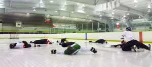 players stretching on the ice